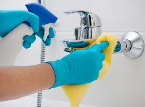 Professional using steam cleaner for office carpets