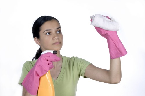 Technician performing deep carpet steam cleaning